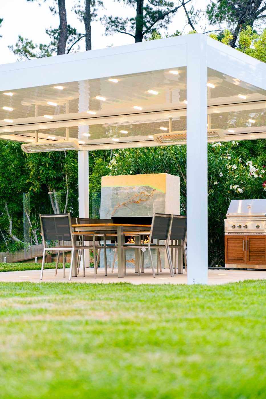 Freestanding white pavilion with dining